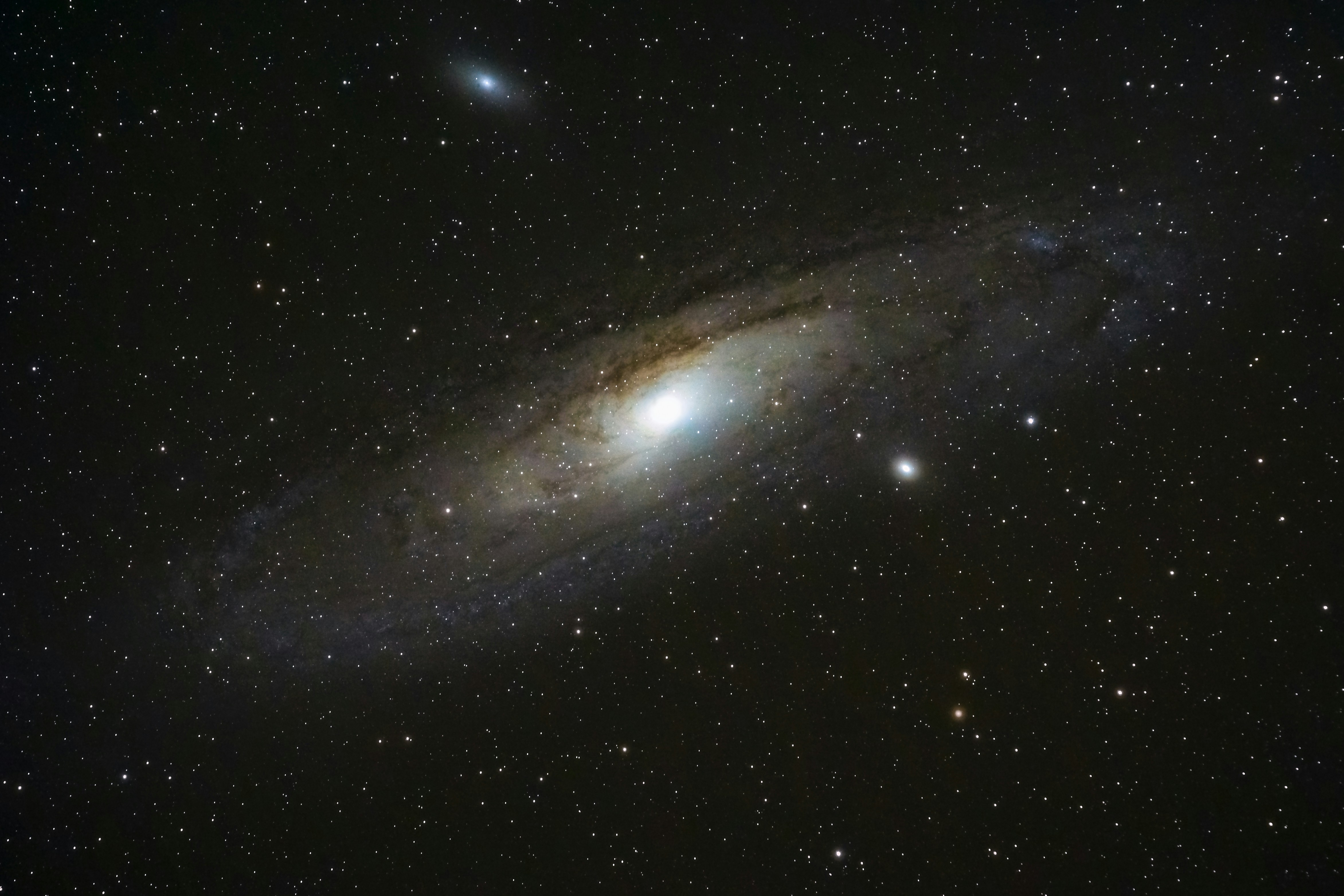 A spiral galaxy swirls in a starfield.